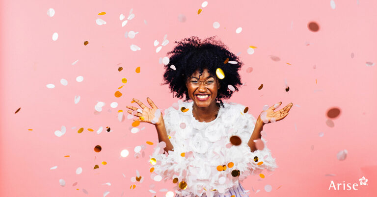 Smiling woman with confetti.