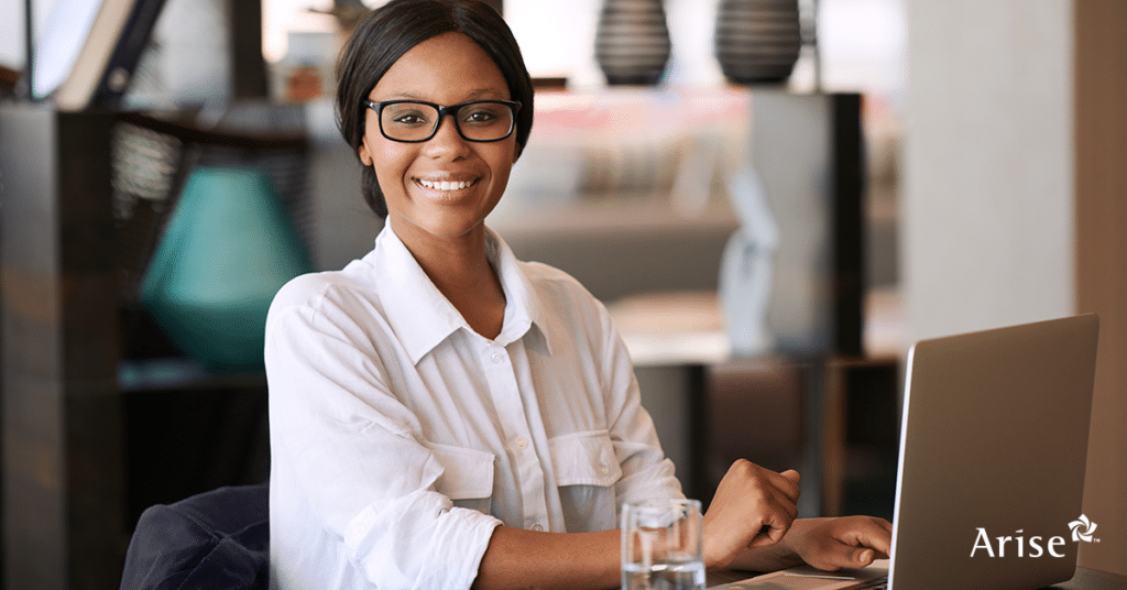 Smiling woman wearing glasses.