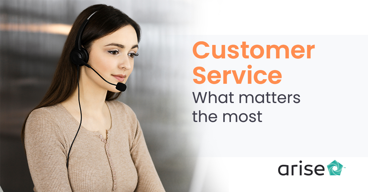 A woman wearing a headset and working on her customer service skills
