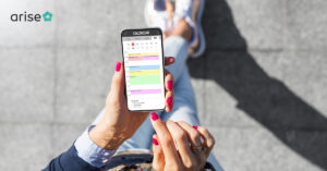 Productivity apps: A woman holding a phone with a calendar app open on the screen