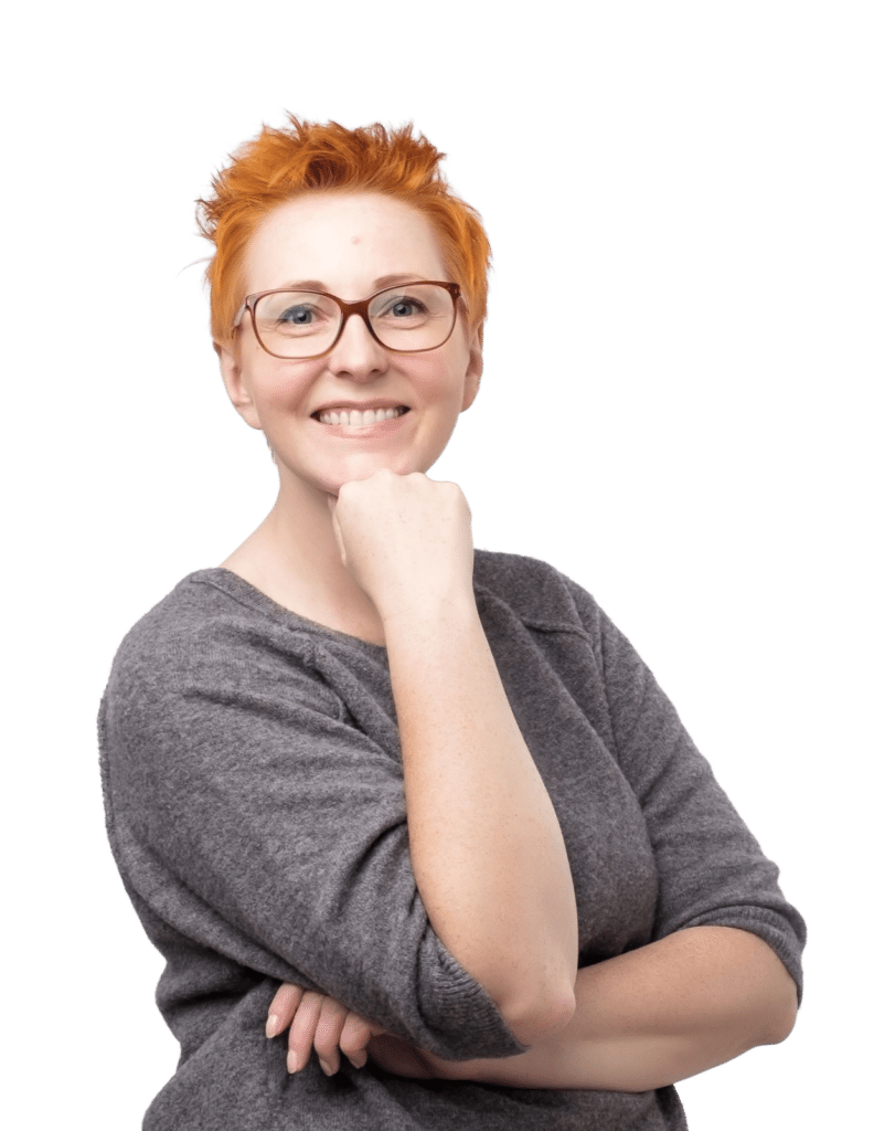 Smiling woman wearing glasses.