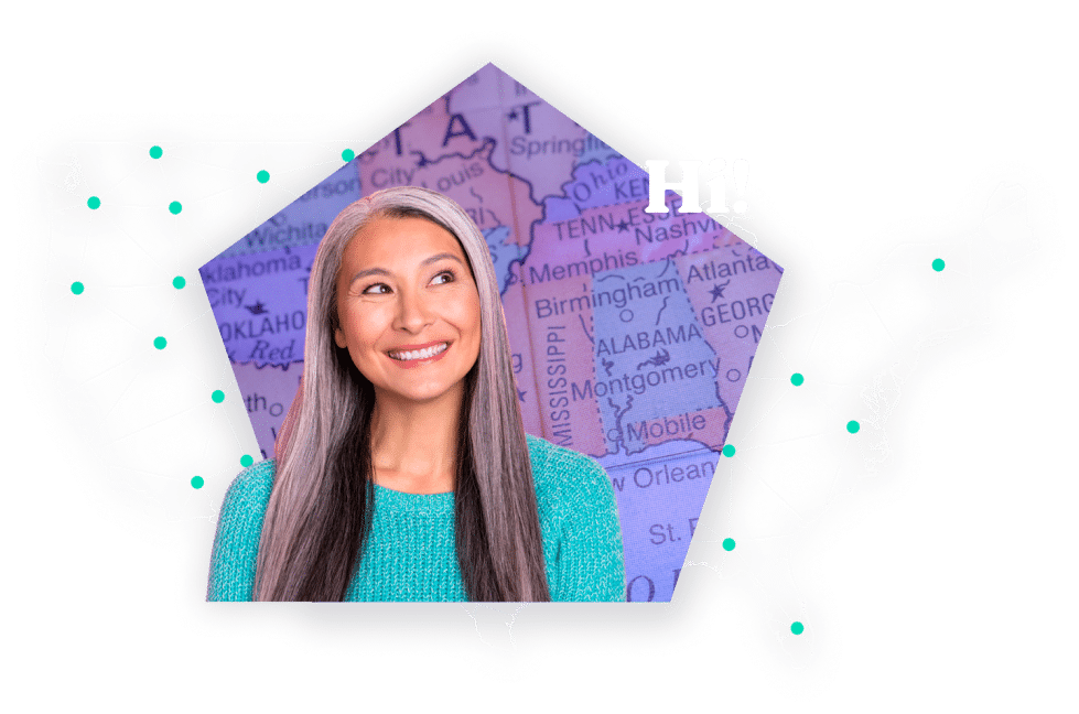 Smiling woman wearing a green sweater standing in front of a map of southern United States.