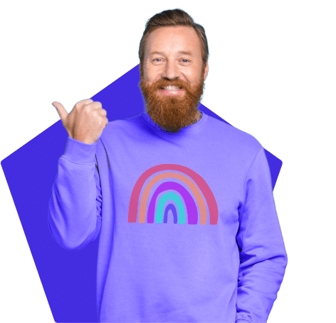 Smiling man wearing a purple shirt with a rainbow and doing a thumbs up.