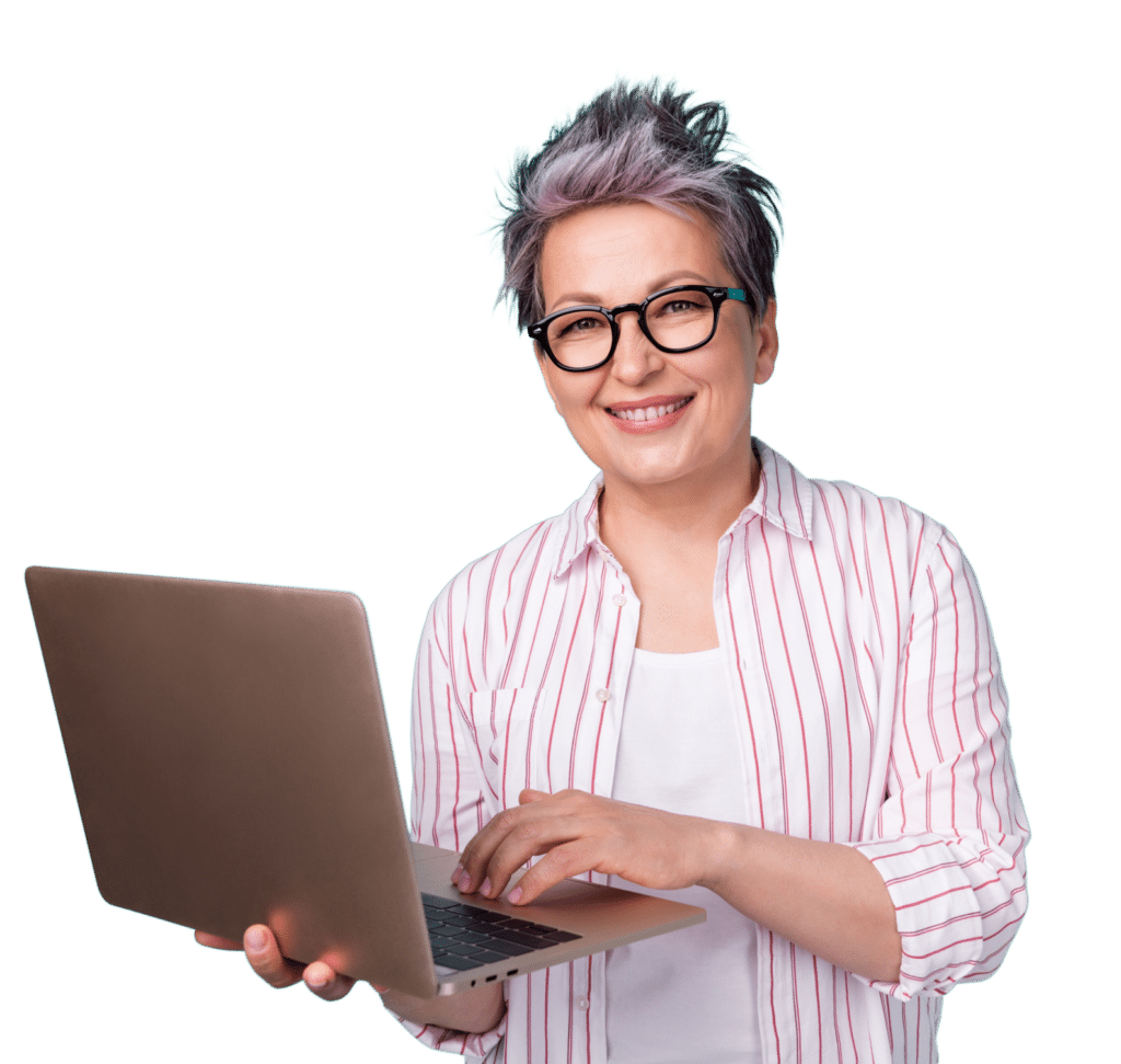 Smiling woman wearing glasses and holding a laptop.