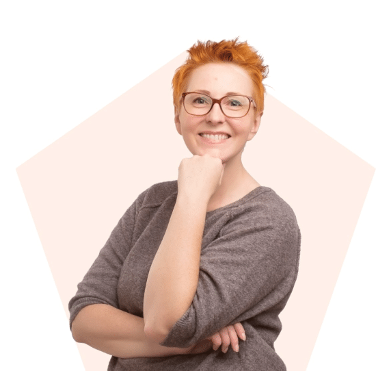 Smiling woman wearing glasses.