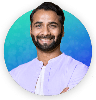 Smiling man wearing a purple shirt.