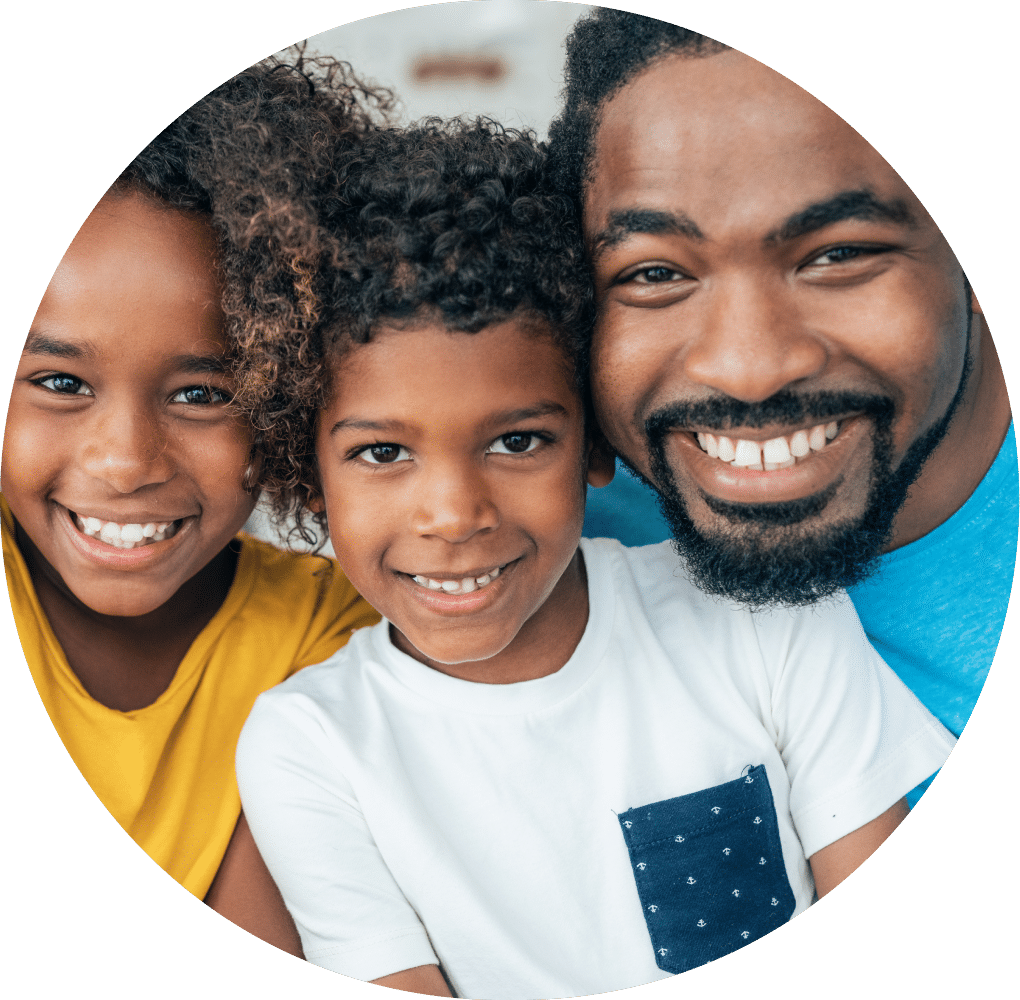 Smiling family of three.