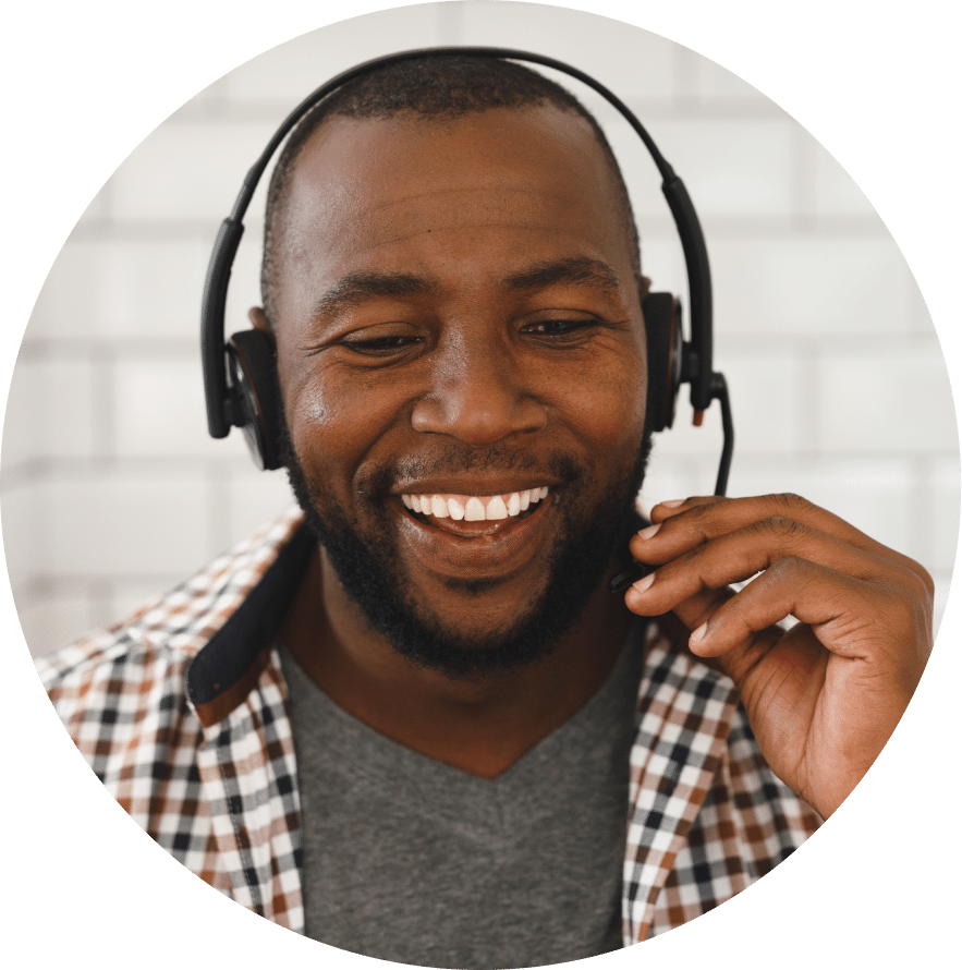 Smiling man wearing headset .