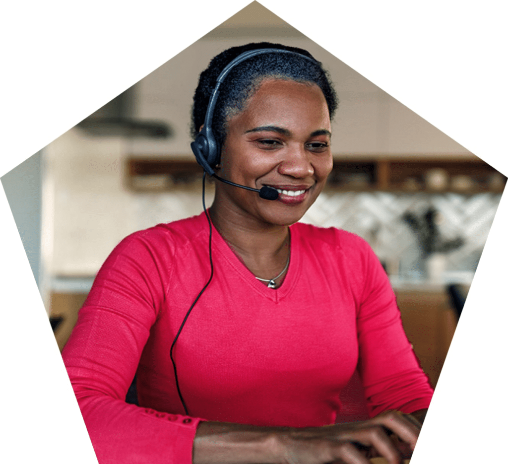 Smiling woman wearing headset.